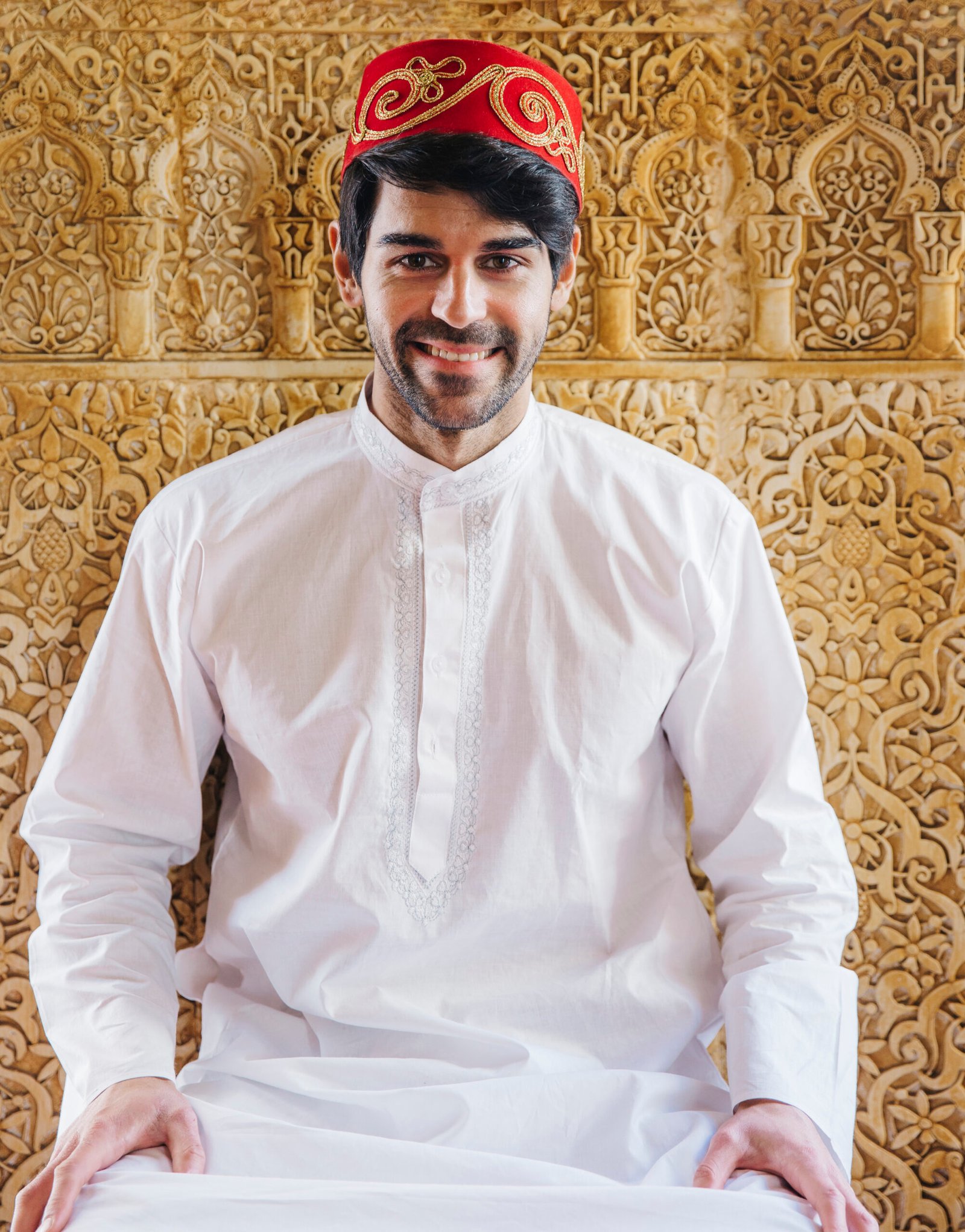 muslim man front golden wall